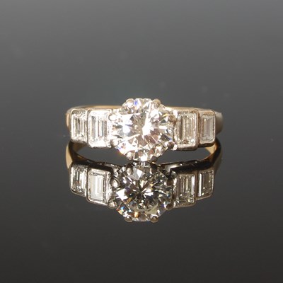 Lot 324 - A yellow and white metal five stone diamond...