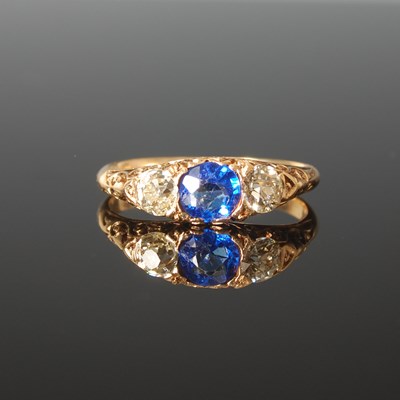 Lot 327 - A Victorian 18ct gold carved side blue garnet...