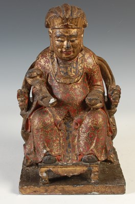 Lot 522 - A Chinese carved gilt wood and polychrome...