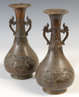 Lot 501 - A pair of Japanese bronze twin handled bottle...