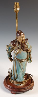 Lot 502 - A Chinese Shiwan pottery figure of Guan Yu...