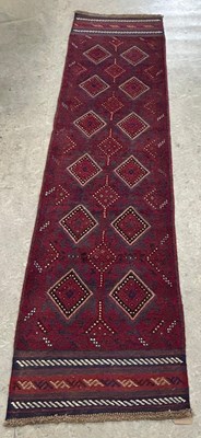 Lot 925 - A Meshwani runner, worked in madder blue and...