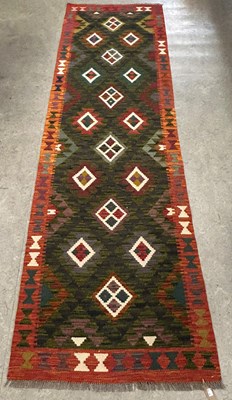 Lot 926 - A Maimana Kilim runner, worked in green,...