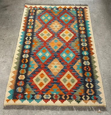 Lot 927 - A Chobi Kilim rug, worked in blue, green,...