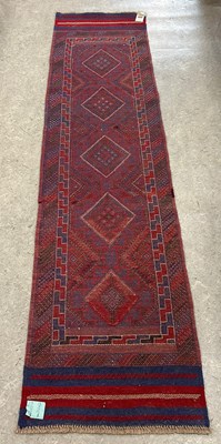 Lot 928 - A Meshwani runner, worked in blue, madder,...