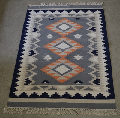 Lot 932 - A John Lewis multi-medallion Indian Kelim rug,...