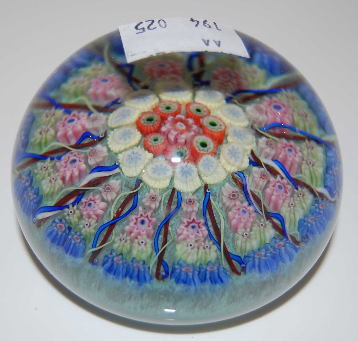 Lot 168 - A green ground millefiori paperweight centred...