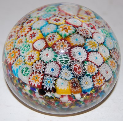 Lot 179 - A colourful millefiori ground paperweight,...