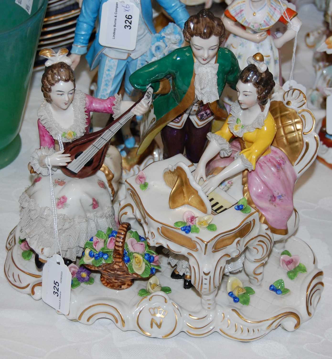 Lot 325 - A Dresden porcelain figure group of musicians,...