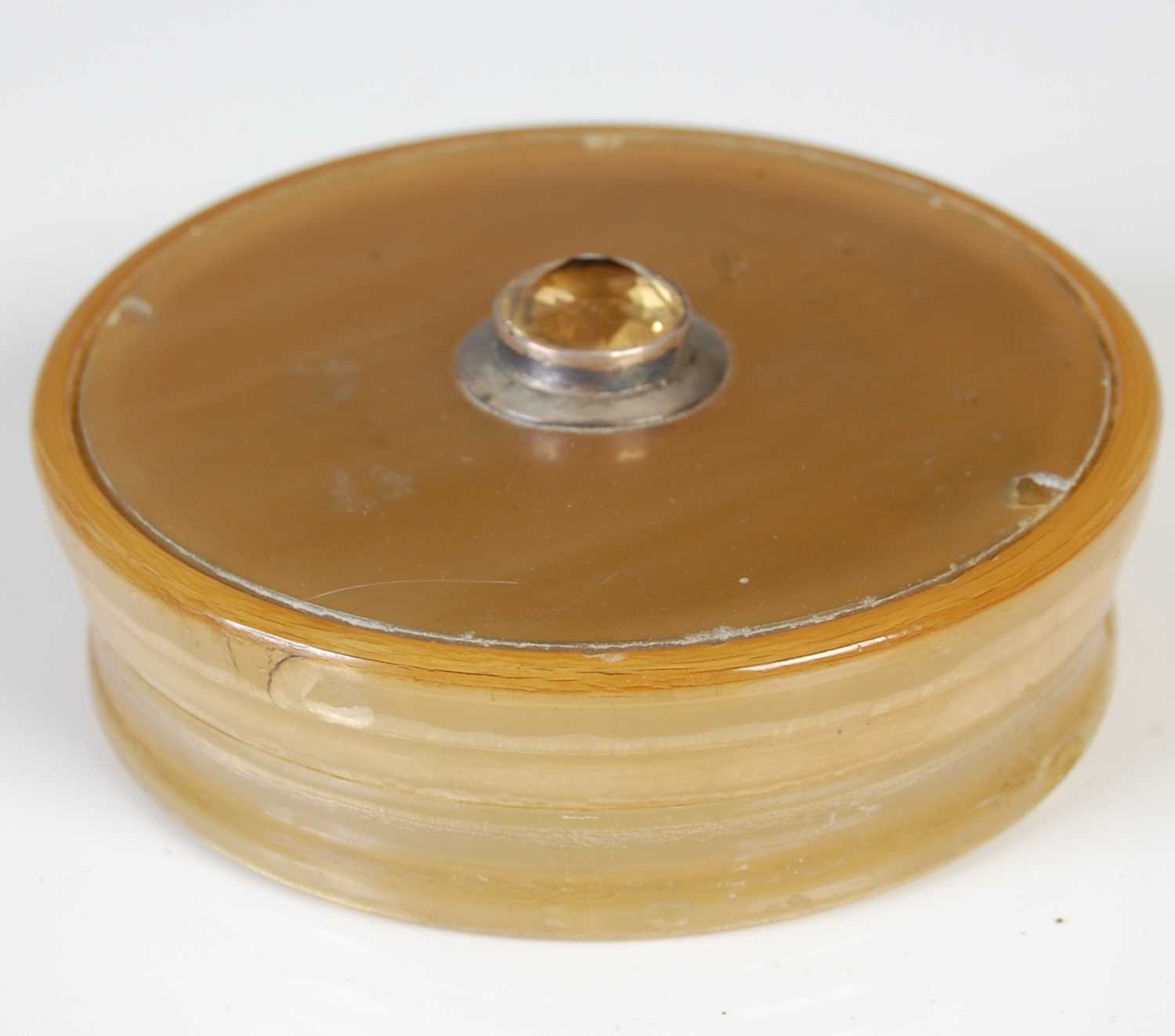 Lot 245 - A Scottish horn circular snuff box with glass...