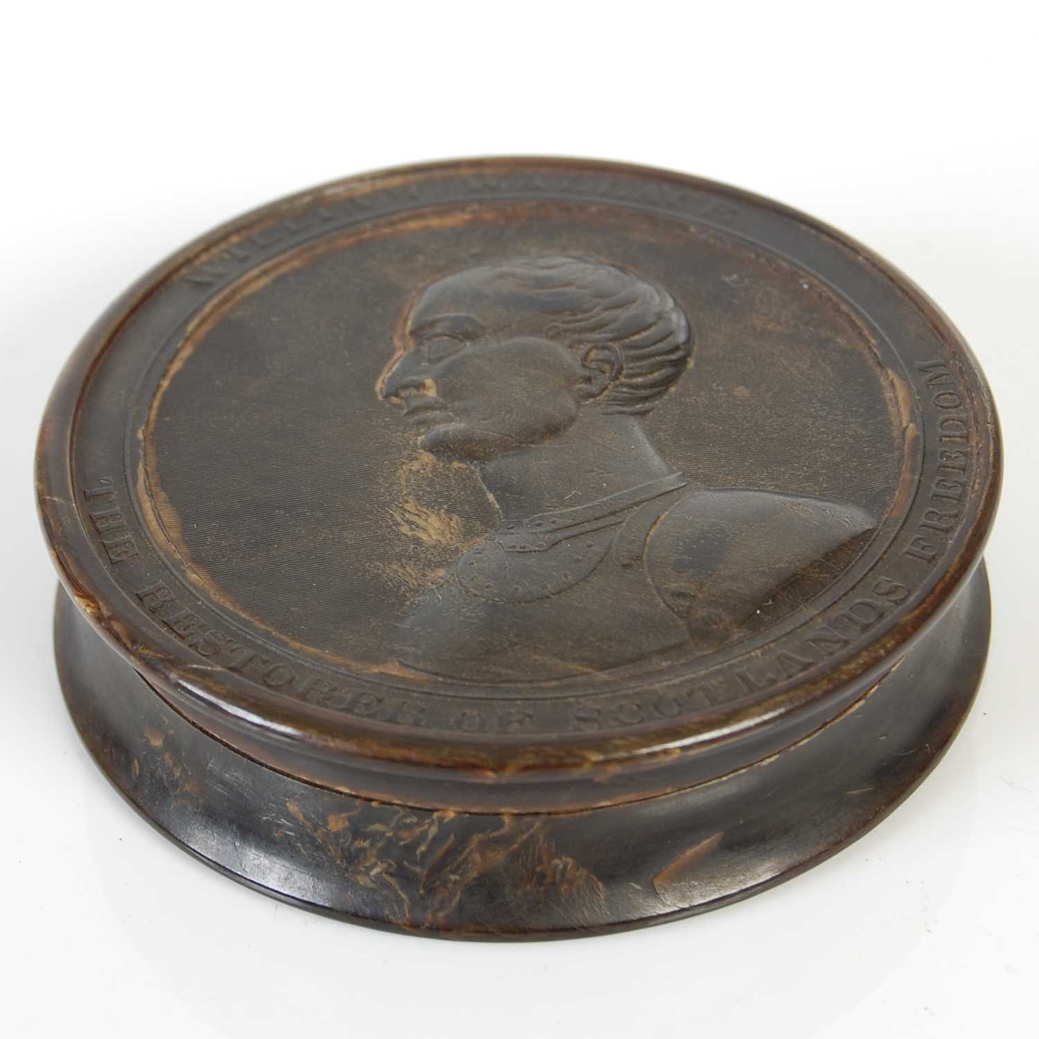 Lot 246 - A pressed horn circular snuff box with...