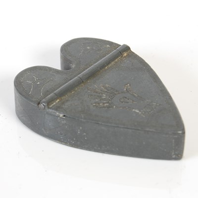 Lot 247 - An unusual heart-shaped pewter snuff box, the...