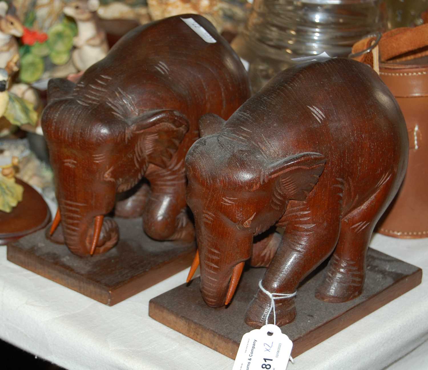 Lot 381 - A pair of wooden carved elephant bookends