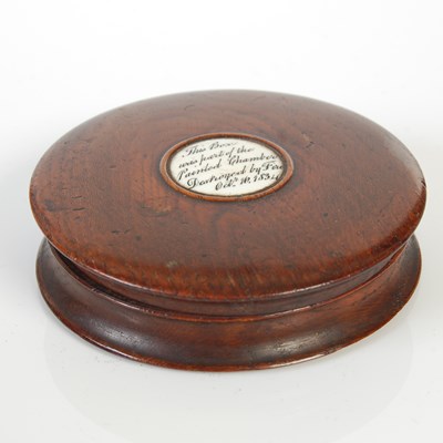 Lot 250 - A treen circular snuff box, with bone inset...