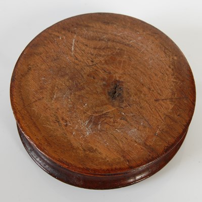 Lot 250 - A treen circular snuff box, with bone inset...
