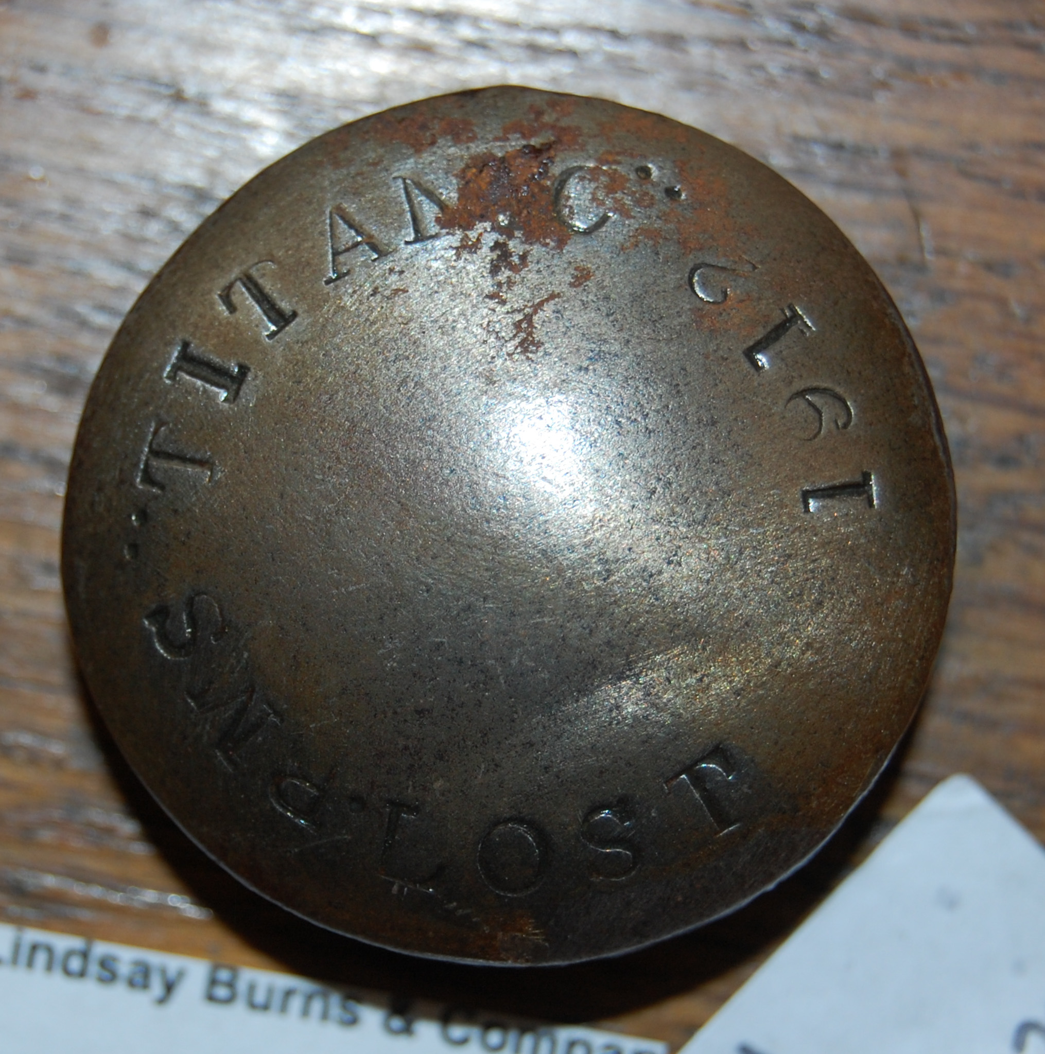 Lot 205 - Titanic interest: a metal souvenir/ rivet?