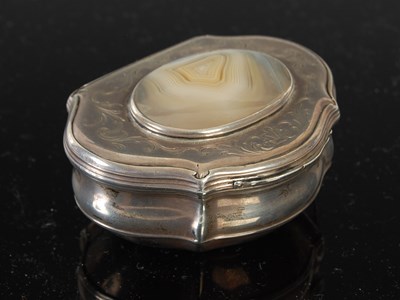 Lot 258 - A silver cartouche-shaped snuff box, the...