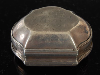 Lot 258 - A silver cartouche-shaped snuff box, the...