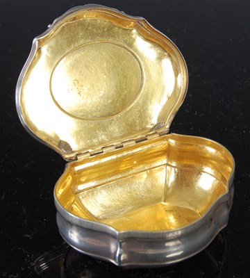 Lot 258 - A silver cartouche-shaped snuff box, the...