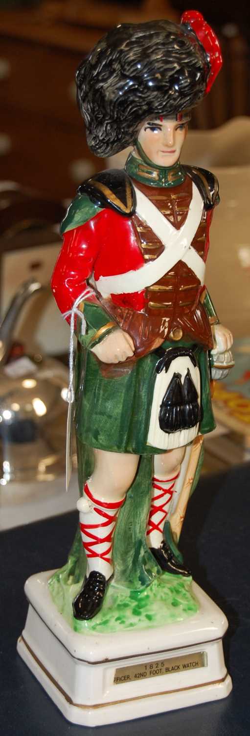 Lot 455 - A ceramic figure group of a 1825 Officer of...