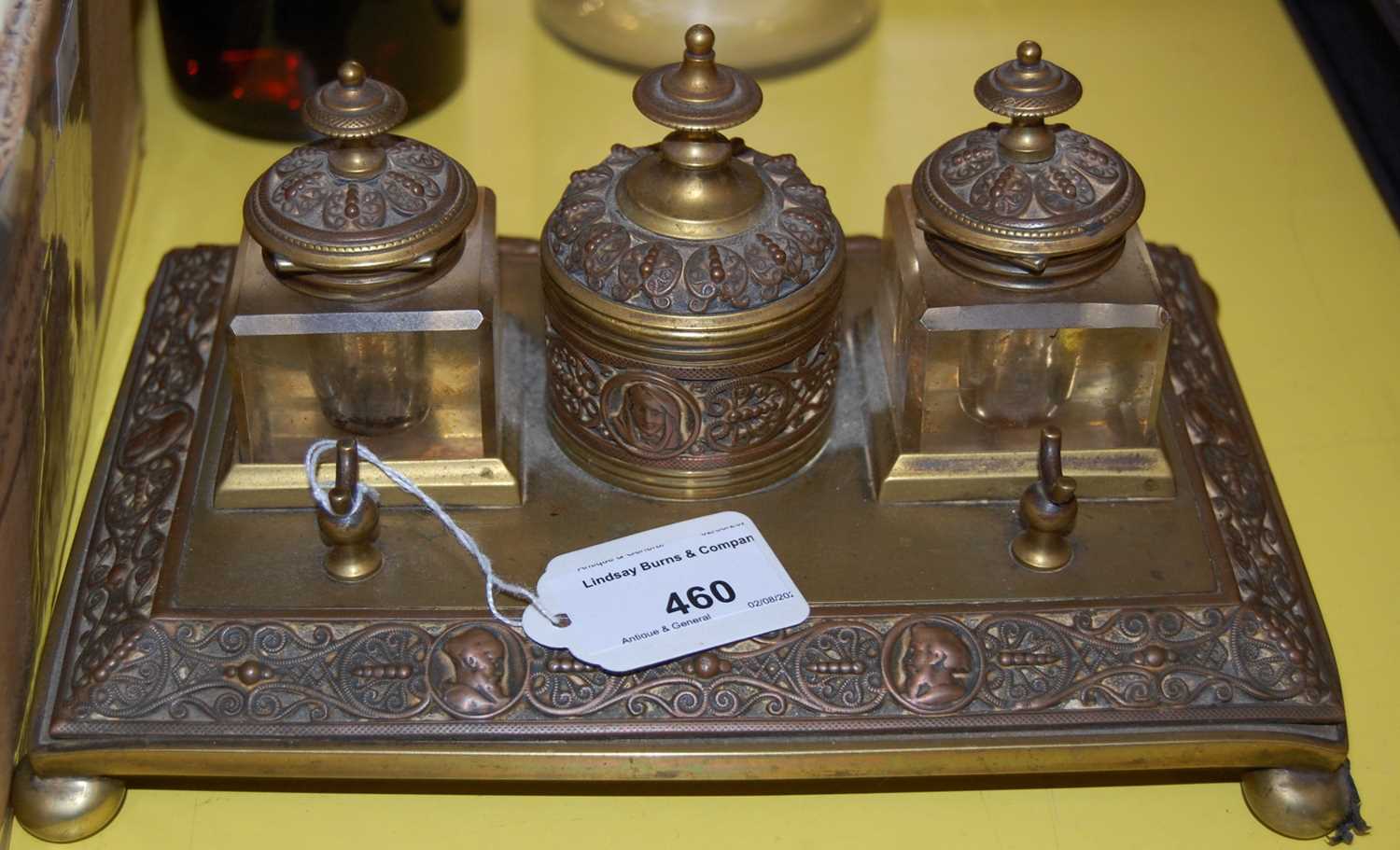 Lot 460 - Arts & Crafts brass desk inkwell set
