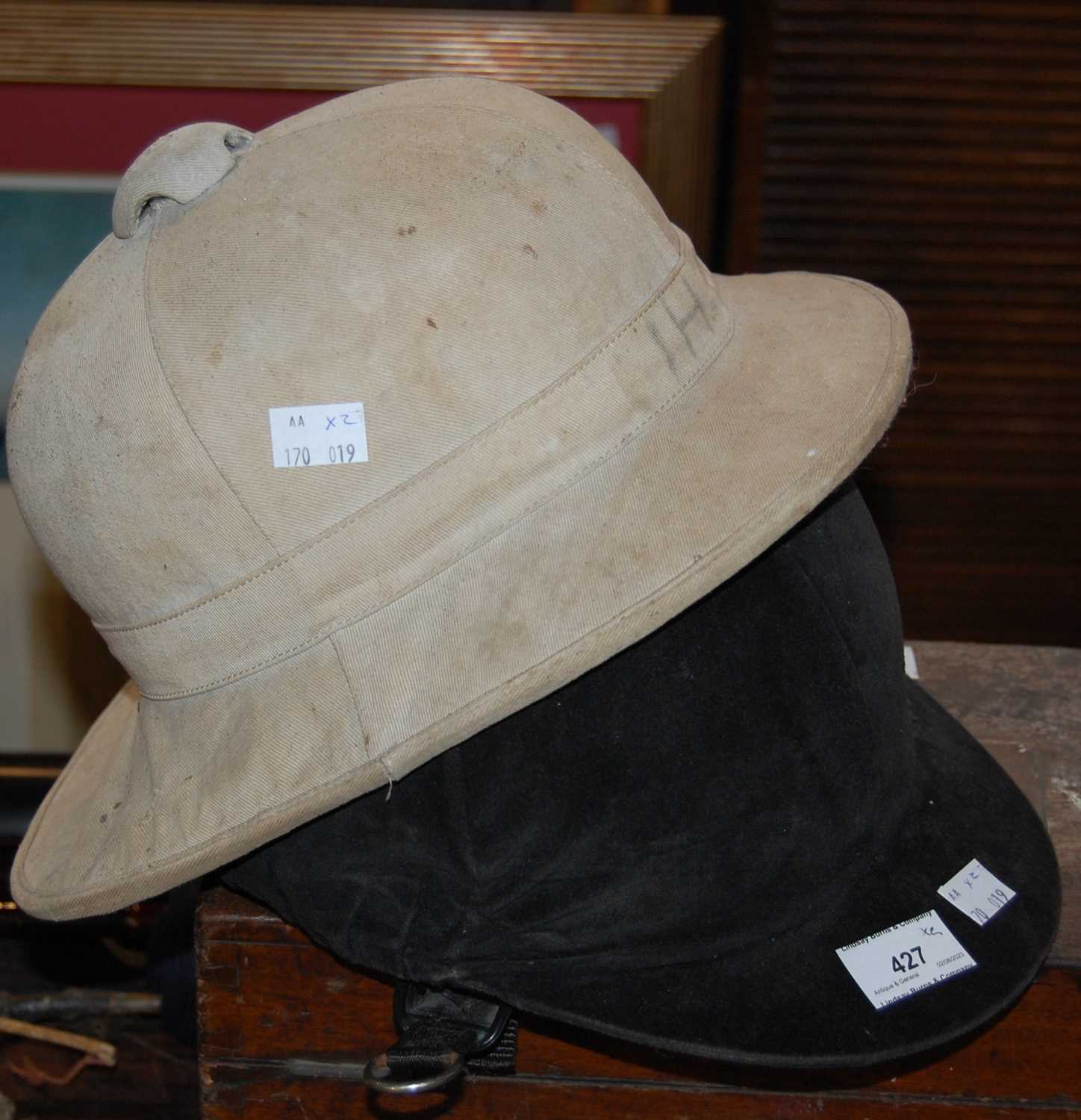 Lot 427 - A vintage pith helmet, together with a Loveson...