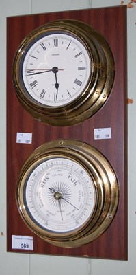 Lot 589 - A Metamec wall mounted clock and barometer