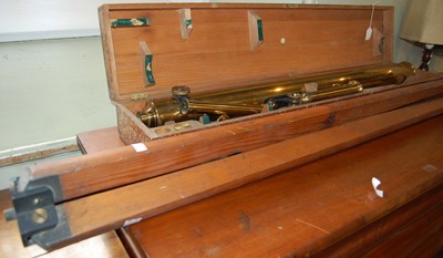 Lot 596 - A vintage cased brass telescope and tripod,...