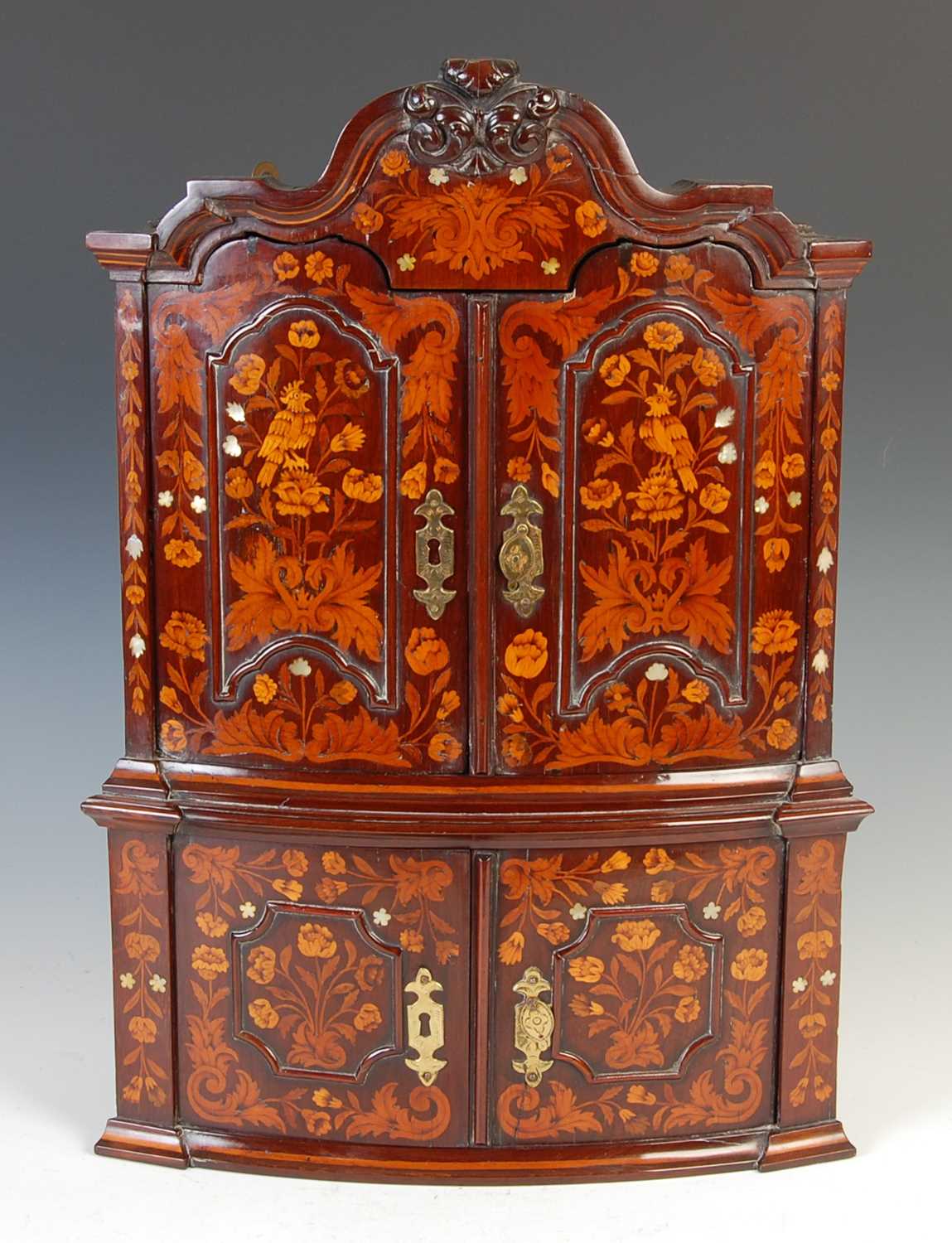 Lot 155 - An 18th century Dutch miniature mahogany and marquetry hanging corner cabinet