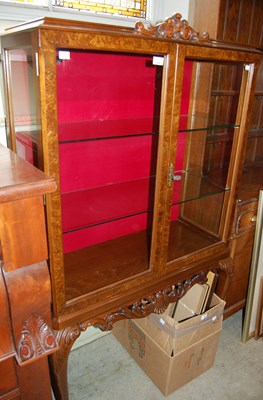 Lot 602 - A 20th century walnut display cabinet raised...