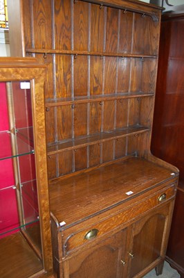 Lot 605 - A 20th century oak dresser, the top section...