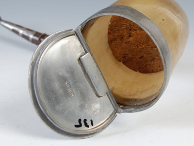 Lot 273 - A large curved horn snuff mull with pewter...