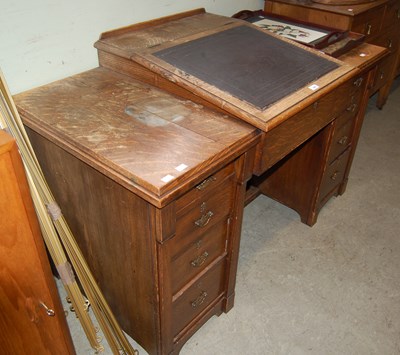 Lot 609 - A 19th century oak kneehole writing desk