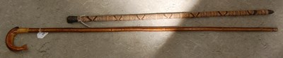 Lot 526 - A horn-handled walking cane, the horn handle...