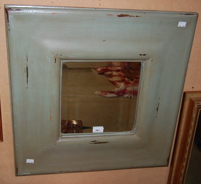Lot 581 - A contemporary square wall mirror with...