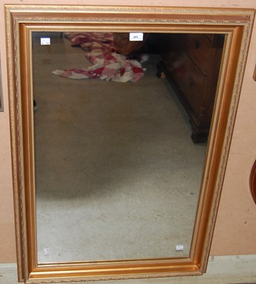 Lot 585 - A rectangular gilt framed wall mirror, 103cm x...