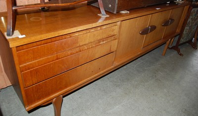 Lot 742 - A stylish mid 20th century teak sideboard, set...