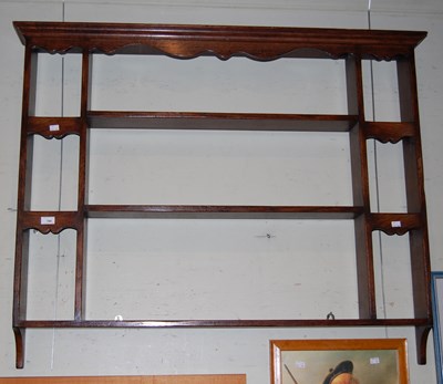 Lot 789 - A dark wood vintage hanging plate rack
