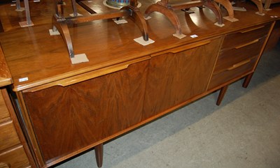 Lot 620 - A teak sideboard and extending dining table