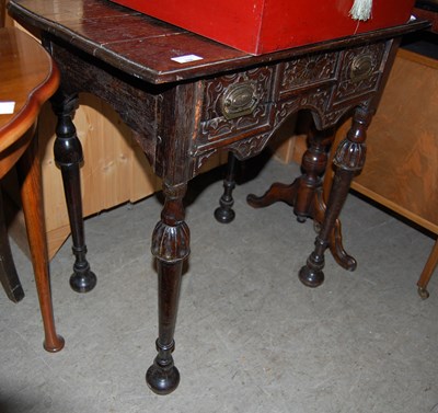 Lot 768 - An antique carved oak side table with single...