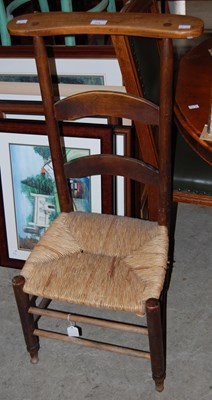 Lot 773 - An Arts & Crafts rush seated prayer chair