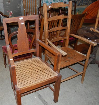 Lot 775 - An Art Deco oak elbow chair with canework seat,...