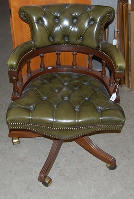 Lot 782 - A green leatherette upholstered button down...