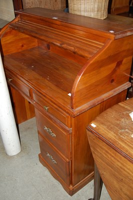 Lot 679 - A stained pine roll-top desk