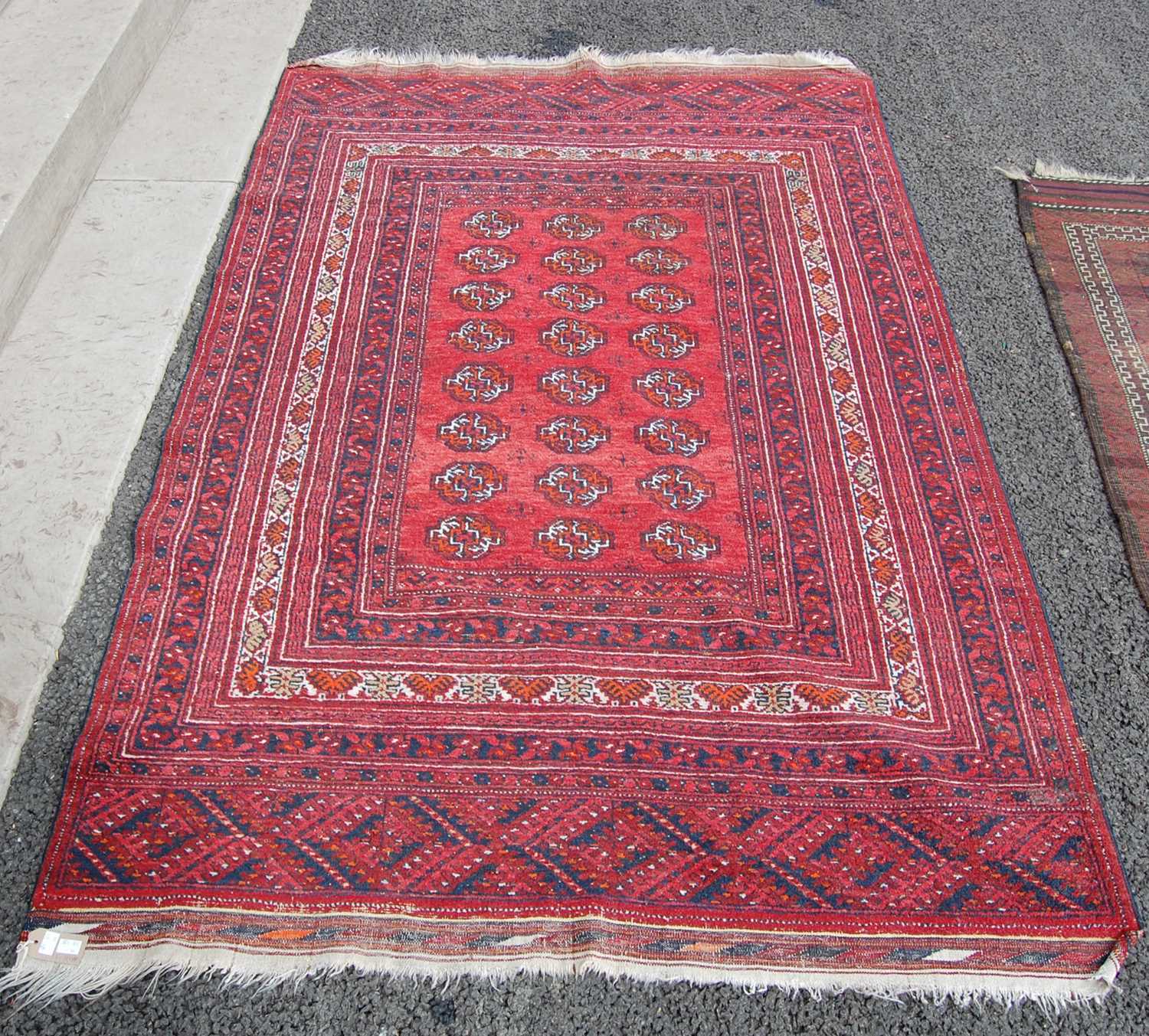 Lot 813 - A Persian Tekke type rug, the madder ground