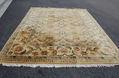 Lot 800 - A large ochre ground carpet with rectangular...