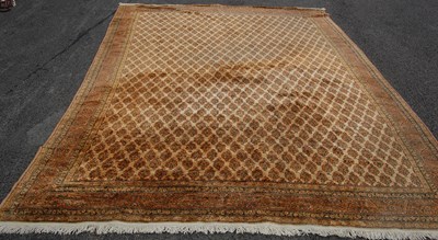 Lot 802 - A Persian style carpet with all-over foliate...