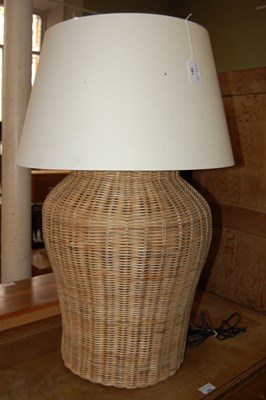 Lot 691 - A basket weave table lamp and shade