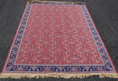 Lot 805 - A Belgian machine made Persian style rug,...