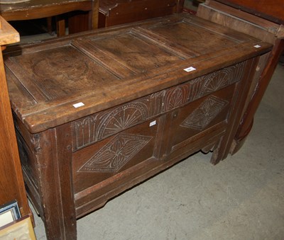Lot 648 - An antique oak coffer with double panelled front